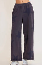 Dark blue wide-leg pants on a white background