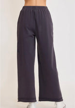 Dark blue wide-leg pants on a white background